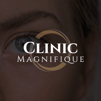 Clinic magnifique logo på mørk baggrund