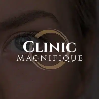 Clinic magnifique logo på mørk baggrund
