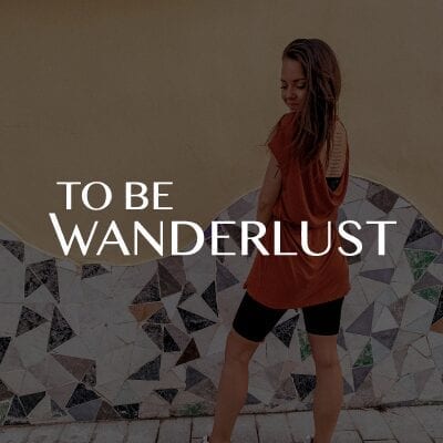 To Be Wanderlust logo på baggrund